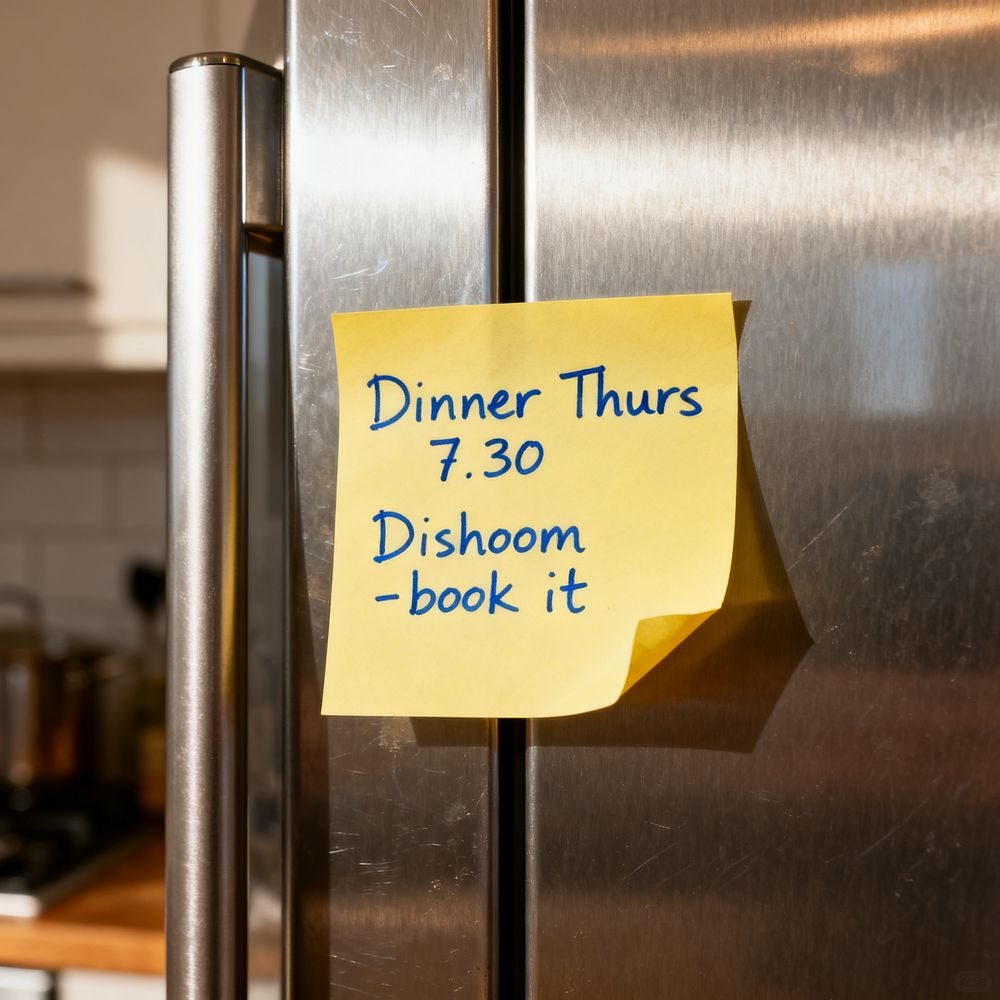 A yellow Post-it on a fridge, handwritten: Dinner Thurs 7.30, Dishoom - book it